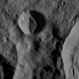 This image of bright spots in a small crater on Ceres was obtained by NASA's Dawn spacecraft on July 1, 2018 from an altitude of about 179 miles (288 kilometers).