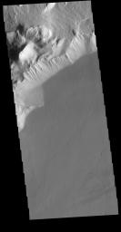 This image from NASA's Mars Odyssey shows Olympus Rupes, the large escarpment surrounding Olympus Mons. The escarpment is a cliff where there is a large elevation change over a short distance.