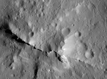 This close-up view of the central peak of the 99-mile-wide (160-kilometer-wide) Urvara impact crater on Ceres was captured by NASA's Dawn spacecraft on June 21, 2018 from an altitude of about 83 miles (134 kilometers).