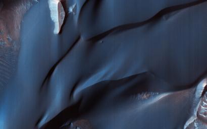 This image acquired on May 16, 2018 by NASA's Mars Reconnaissance Orbiter, shows sand dunes in Melas Chasma, located within the Valles Marineris canyon system.