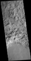 This image from NASA's Mars Odyssey shows part of the northern rim of an unnamed crater in Hesperia Planum.