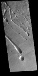 This image from NASA's Mars Odyssey shows linear features located on part of the large flow feature on the southern flank of Ascraeus Mons.