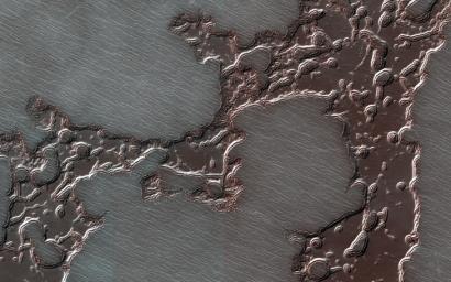 This image acquired on August 20, 2018 by NASA's Mars Reconnaissance Orbiter, shows remnants of a deposit, composed of dry ice layered together with dust and water ice, that form the south polar residual cap.