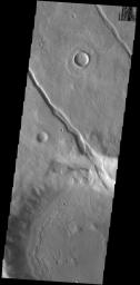 This image from NASA's Mars Odyssey shows an unnamed crater, located on the northern margin of Aonia Terra, interacting with one of the fossa, also called a graben.