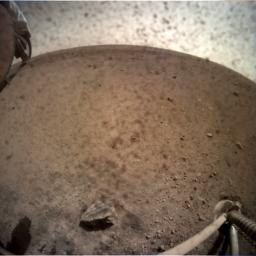 NASA's InSight spacecraft flipped open the lens cover on its Instrument Context Camera (ICC) on Nov. 30, 2018, and captured this view of Mars.