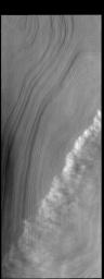 This image from NASA's Mars Odyssey shows a line of clouds located over the ice of the south polar cap.