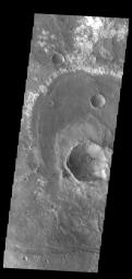 This image from NASA's Mars Odyssey shows a group of craters in Terra Sirenum. The apparent youngest one is the center crater with the scalloped rim.