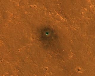 NASA's InSight spacecraft and its recently deployed Wind and Thermal Shield were imaged on Feb. 4, 2019, by the HiRISE camera aboard NASA's Mars Reconnaissance Orbiter.