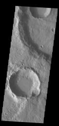 This image from NASA's Mars Odyssey shows three craters. Investigating the relative ages of each crater indicates the largest crater formed first followed at some point by the smaller craters.