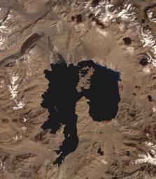 NASA's Terra spacecraft shows Lake Karakul in northeast Tajikistan, a hypersaline lake with no external drainage, receiving less than 3 cm precipitation per year.