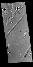 This image from NASA's Mars Odyssey shows linear depressions, graben, called Labeatis Fossae.