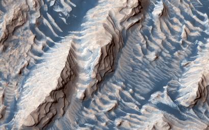 This image, acquired on June 10, 2019 by NASA's Mars Reconnaissance Orbiter, shows sedimentary rock and sand within Danielson Crater, located in the southwest Arabia Terra region of Mars.