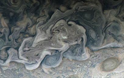NASA's Juno spacecraft captured this image of layers of clouds swirling in Jupiter's atmosphere.
