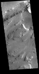 This image from NASA's Mars Odyssey shows part of Sacra Mensa, a large mesa located between the north and south channels of Kasei Valles.
