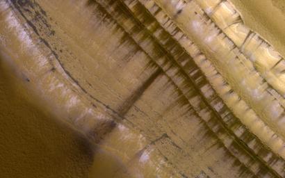 This image acquired on March 21, 2021 by NASA's Mars Reconnaissance Orbiter, shows the very steep outer scarp of the north polar layered deposits.