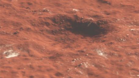 This animation depicts a flyover of a meteoroid impact crater on Mars that's surrounded by boulder-size chunks of ice. The animation was created using data from the HiRISE camera aboard NASA's Mars Reconnaissance Orbiter.