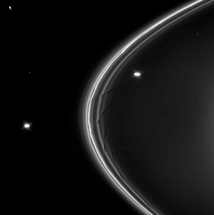 Closer image of the F ring and its shepherd satellites Prometheus (inner orbit) and Pandora (outer orbit) (NASA/PIA07712)