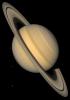 This approximate natural-color image from NASA's Voyager 2 shows Saturn, its rings, and four of its icy satellites. Three satellites Tethys, Dione, and Rhea are visible against the darkness of space.