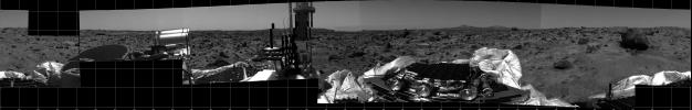 This photomosaic was taken by NASA's Imager for Mars Pathfinder (IMP) camera on July 4, 1997 between 4:00-4:30 p.m. PDT. The foreground is dominated by the lander, newly renamed the Sagan Memorial Station after the late Dr. Carl Sagan.