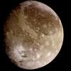 Natural color view of Ganymede from NASA's Galileo spacecraft during its first encounter with the satellite. The dark areas are the older, more heavily cratered regions and the light areas are younger, tectonically deformed regions.