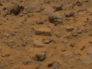 Taken by NASA's Imager for Mars Pathfinder (IMP), this image shows the rock dubbed 'Flat Top' at center. Dust has accumulated on the top of Flat Top, but is not present on the sides due to the steep angles of the rock.