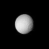 Special processing has brought out surface detail in NASA's Voyager 2 image focusing on the large crater on Tethys. The spacecraft took this photograph Aug. 25, 1981, when it was 826,000 kilometers (513,000 miles) from the icy moon of Saturn
