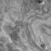 NASA's Mars Global Surveyor acquired this image on April 11, 1998. Shown here are layered materials in the walls and on the floors of the enormous Valles Marineris system.