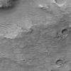 NASA's Mars Global Surveyor shows the cratered uplands located between the Amenthes Fossae and Hesperia Planum with windblown dunes and ripples.
