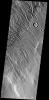 This heavily dissected surface is located within the Acheron Fossae region on Mars as seen by NASA's Mars Odyssey spacecraft.