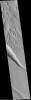NASA's Mars Global Surveyor shows a wide area along the edge of the hilly, Gigas Sulci terrain on Mars with several troughs that look something like gashes made by a giant knife.