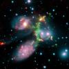 The false-color composite image of the Stephan's Quintet galaxy cluster is made up of data from NASA's Spitzer Space Telescope and a ground-based telescope in Spain.