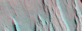 Layers of bedrock etched by wind to form sharp, elongated ridges known to geomorphologists as yardangs are commonplace in the southern Elysium Planitia/southern Amazonis region of Mars as seen by NASA's Mars Global Surveyor.