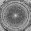 Bands of eastward and westward winds on Jupiter appear as concentric rotating circles in this frame from a movie composed of NASA Cassini spacecraft images that have been re-projected as if the viewer were looking down at Jupiter's north pole.