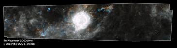 This Spitzer Space Telescope composite shows the supernova remnant Cassiopeia A (white ball) and surrounding clouds of dust (gray, orange and blue). It consists of two processed images taken one year apart.