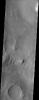 The larger craters in this image from NASA's Mars Odyssey spacecraft showing a region north of Elysium Mons are buried and distorted almost beyond recognition.