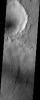 Except for the loss of its ring of ejecta, the crater at the leading edge of this streamlined island in Kasei Vallis, imaged here by NASA's Mars Odyssey, shows no hint of the catastrophic floods that passed by it.