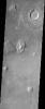 The Cydonia region on Mars, seen in this image from NASA's Mars Odyssey spacecraft, straddles the boundary between the bright, dusty, cratered highlands to the southeast and the dark, relatively dust-free, lowland plains to the west.