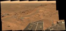 This mini-panorama was taken by NASA's Spirit rover on August 23, 2005, just as the rover finally completed its intrepid climb up Husband Hill. The summit shows a windswept plateau of scattered rocks, little sand dunes and small exposures of outcrop.