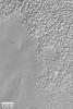 NASA's Mars Global Surveyor shows a typical southern mid-latitude surface on Mars at very high resolution. The smooth-surfaced material erodes and breaks down into the knobby terrain.