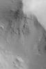 NASA's Mars Global Surveyor shows a boulder has rolled down a slope in the martian region of Gordii Dorsum of Mars. The boulder sits at the end of the track.