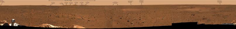 The arrows in this 360-degree panoramic view of the martian surface identify hills and craters on the martian horizon taken on Mars by the panoramic camera onboard NASA's Mars Exploration Rover Spirit.