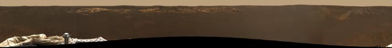 NASA's Mars Exploration Rover Opportunity shows the expansive view of the martian real estate. he airbag marks, or footprints, seen in the soil trace the route by which the rover rolled to its final resting spot inside a small crater at Meridiani Planum.