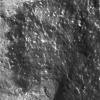 NASA's Mars Exploration Rover Spirit shows a cleaned off portion of the rock dubbed Adirondack. In preparation for grinding into the rock, Spirit wiped off a fine coat of dust with a stainless steel brush located on its rock abrasion tool.