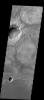 This image from NASA's 2001 Mars Odyssey released on Jan 27, 2004 shows some impressive recent craters on Mars, as well as the barely-visible marks of older craters on Meridiani Planum.