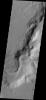 This image, part of an images as art series from NASA's 2001 Mars Odyssey released on March 25, 2004 shows part of the Auqakuh Vallis region on Mars. The image shows the presence of liquid or ice carved channels and some dunes.
