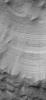 NASA's Mars Global Surveyor shows layers exposed in the walls of a crater-like form in the south polar region of Mars.