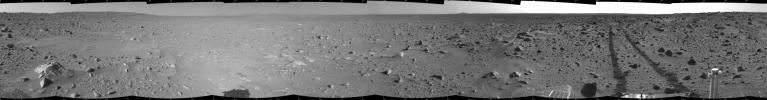 This cylindrical-projection mosaic was created by NASA's Mars Exploration Rover Spirit acquired on sol 93 (April 7, 2004). It reveals the martian view from Spirit's position during the four-sol flight software update that began on sol 94.