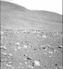 NASA's Mars Exploration Rover Spirit took this gray-scale panoramic camera image of the 'Columbia Hills' on sol 107 (April 21, 2004). The hills are seen rising above a rocky martian surface in the foreground.