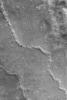 NASA's Mars Global Surveyor shows evidence of a collapsed lava tube (or other form of subterranean channel) on the plains northwest of the Elysium volcanoes on Mars.