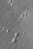 NASA's Mars Global Surveyor shows yardangs located in western Arabia Terra, northwest of the Sinus Meridiani region where the Mars Exploration Rover, Opportunity, has examined ancient sedimentary rocks. 